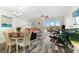 Living room with orange couch and access to balcony at 9397 Midnight Pass Rd # 906, Sarasota, FL 34242