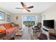 Spacious living room with large windows and ocean view at 9397 Midnight Pass Rd # 906, Sarasota, FL 34242
