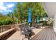 Inviting patio with table, chairs, and umbrellas at 9397 Midnight Pass Rd # 906, Sarasota, FL 34242