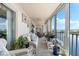 Relaxing sunroom offering stunning water views at 9397 Midnight Pass Rd # 906, Sarasota, FL 34242