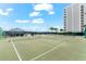 Outdoor tennis and pickleball courts with surrounding landscape at 9397 Midnight Pass Rd # 906, Sarasota, FL 34242