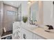 Spa-like bathroom with walk-in shower, modern vanity, and pebble floor at 0 Symco Ave, North Port, FL 34286