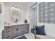 Bathroom with walk-in shower, gray cabinets, and a modern vanity at 0 Symco Ave, North Port, FL 34286