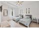 Bright bedroom with two twin beds, light wood floors, and decorative oars at 0 Symco Ave, North Port, FL 34286