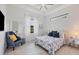Guest bedroom with queen-size bed and window seat at 0 Symco Ave, North Port, FL 34286