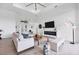 Spacious living room with a modern fireplace and large windows at 0 Symco Ave, North Port, FL 34286