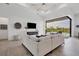 Open living space featuring a sectional sofa and sliding glass doors to the pool area at 0 Symco Ave, North Port, FL 34286