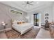Main bedroom with king-size bed and access to the backyard at 0 Symco Ave, North Port, FL 34286