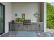 Outdoor kitchen with gray cabinets, stainless steel appliances, and a stylish rug at 0 Symco Ave, North Port, FL 34286