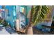 Side view of teal mobile home showcasing AC unit and storage at 10315 Cortez W Rd # 47-2, Bradenton, FL 34210