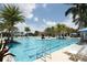 Large resort-style pool with plenty of lounge chairs at 10796 Tarflower Dr # 102, Venice, FL 34293