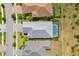 Aerial view of house with pool and landscaped backyard at 11877 Hunters Creek Rd, Venice, FL 34293