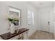 Bright entryway with a console table and a view into the living area at 11877 Hunters Creek Rd, Venice, FL 34293