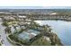 Community overview featuring tennis courts, lake, and clubhouse at 12606 Fontana Loop, Bradenton, FL 34211