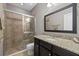 Bathroom with granite countertop and walk-in shower at 12606 Fontana Loop, Bradenton, FL 34211