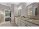 Double vanity bathroom with granite countertops and large shower at 12606 Fontana Loop, Bradenton, FL 34211