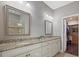 Double vanity bathroom with granite countertops and walk-in closet at 12606 Fontana Loop, Bradenton, FL 34211