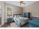 Guest bedroom with blue dresser and hardwood floors at 12606 Fontana Loop, Bradenton, FL 34211