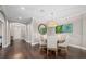 Casual dining area with a round table, four chairs, and wood floors at 12606 Fontana Loop, Bradenton, FL 34211
