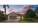 Single-story house with a two-car garage and well-manicured landscaping at 12606 Fontana Loop, Bradenton, FL 34211