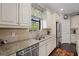 Modern kitchen with granite counters and stainless steel appliances at 12606 Fontana Loop, Bradenton, FL 34211