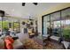 Covered patio with outdoor kitchen, seating area, and access to the home's interior at 12606 Fontana Loop, Bradenton, FL 34211