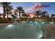 Tranquil pool scene at sunset, illuminated at night at 12606 Fontana Loop, Bradenton, FL 34211