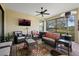 Relaxing screened lanai with wicker furniture and ceiling fan at 12606 Fontana Loop, Bradenton, FL 34211