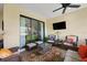 Comfortable patio with wicker furniture, a coffee table, and views into the home at 12606 Fontana Loop, Bradenton, FL 34211