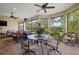 Spacious covered patio featuring comfortable seating, dining area, and serene backyard views at 12606 Fontana Loop, Bradenton, FL 34211