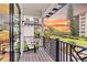 Private balcony with a chair and sunset view at 129 Mckinley Dr, Sarasota, FL 34236
