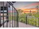 Spiral staircase access to balcony with sunset view at 129 Mckinley Dr, Sarasota, FL 34236