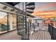 Outdoor balcony with spiral stairs and seating at 129 Mckinley Dr, Sarasota, FL 34236