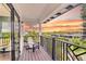 Relaxing balcony with sunset views and comfy chair at 129 Mckinley Dr, Sarasota, FL 34236