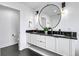 Bathroom features a double vanity with modern black fixtures at 129 Mckinley Dr, Sarasota, FL 34236