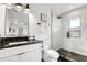 Bathroom with walk-in shower, modern vanity, and dark countertop at 129 Mckinley Dr, Sarasota, FL 34236