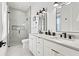 Modern bathroom with double vanity, a large shower, and neutral tones at 129 Mckinley Dr, Sarasota, FL 34236
