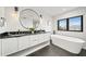Modern bathroom with double vanity,freestanding tub, and walk-in shower at 129 Mckinley Dr, Sarasota, FL 34236
