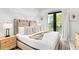 Spacious bedroom with a king-size bed and access to a private balcony at 129 Mckinley Dr, Sarasota, FL 34236