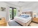 Spacious bedroom with private balcony and tranquil setting at 129 Mckinley Dr, Sarasota, FL 34236