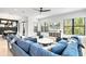 Spacious living room with a large sectional sofa and plenty of natural light at 129 Mckinley Dr, Sarasota, FL 34236
