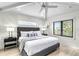 Bright bedroom with a king-size bed and wood floors at 129 Mckinley Dr, Sarasota, FL 34236
