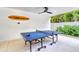 Outdoor Ping Pong table in covered patio area at 129 Mckinley Dr, Sarasota, FL 34236