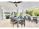 Covered patio with dining table, lounge chairs and a view of the pool at 129 Mckinley Dr, Sarasota, FL 34236