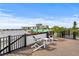 Rooftop deck with city views and seating for two at 129 Mckinley Dr, Sarasota, FL 34236