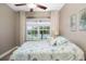 Comfortable bedroom with large window and wood floors at 2338 126Th E Dr, Parrish, FL 34219