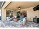 Covered patio with seating area and view of living room at 24160 Gallberry Dr, Venice, FL 34293