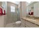 Clean bathroom with granite countertop and glass shower at 24160 Gallberry Dr, Venice, FL 34293