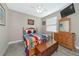 Guest bedroom with wood furniture and a TV at 24160 Gallberry Dr, Venice, FL 34293