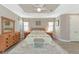 Spacious Primary bedroom with ample natural light and walk-in closet at 24160 Gallberry Dr, Venice, FL 34293